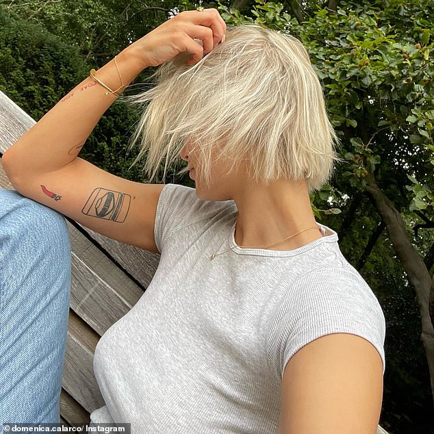 'Blonde, bra-less and in London,' Domenica captioned the photo. The star looked happy with her stylish transformation