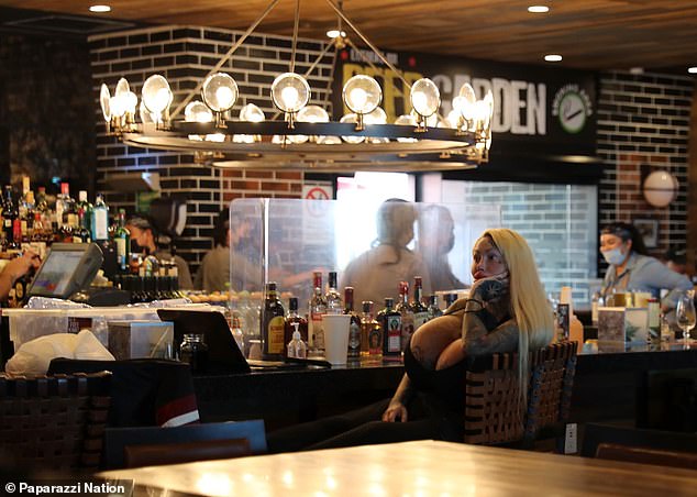 Before catching her flight, the 30-year-old was spotted sitting alone at the airport bar