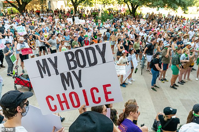 Alito authored the Supreme Court's decision to overturn Roe v Wade. Above, demonstrators protest the ruling