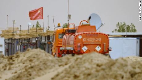 A Soviet flag flies over the processing plant deep in the Sudanese desert, a facility known to locals as the &quot;Russian company.&quot;