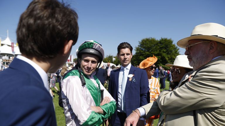 Ryan Moore speaks with connections of Khaadem at Goodwood