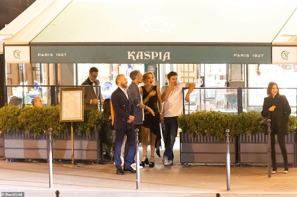 What a group: Taika, Rita and Casey were seen chatting outside the French eatery