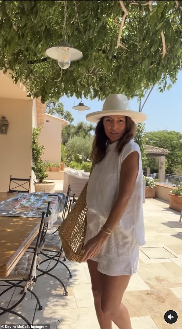 Gorgeous: The Masked Singer judge then slipped into a casual white shirt and shorts co-ord, before coming up close to the camera and showing her natural makeup look