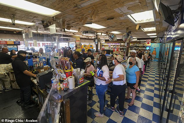 The Blue Bird Liquor store in Los Angeles saw big lines on Friday as people rushed to try and overcome the 1 in 303 million odds to win