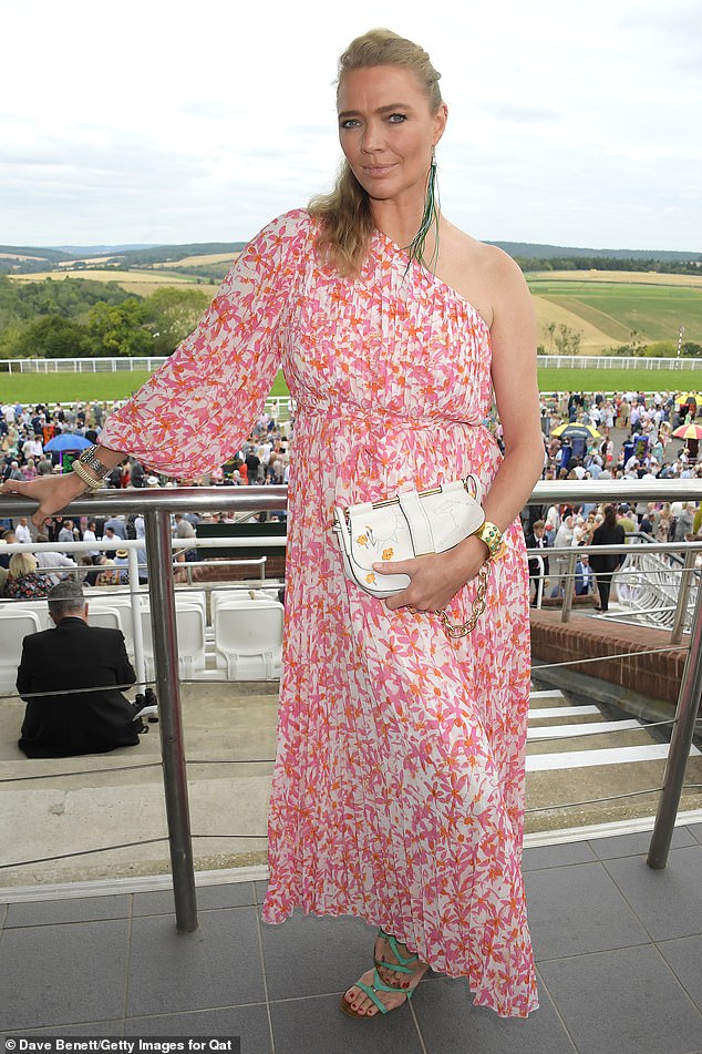 Pretty in pink: She went on to further accessorise the look with a white clutch bag and a pair of contrasting green sandals