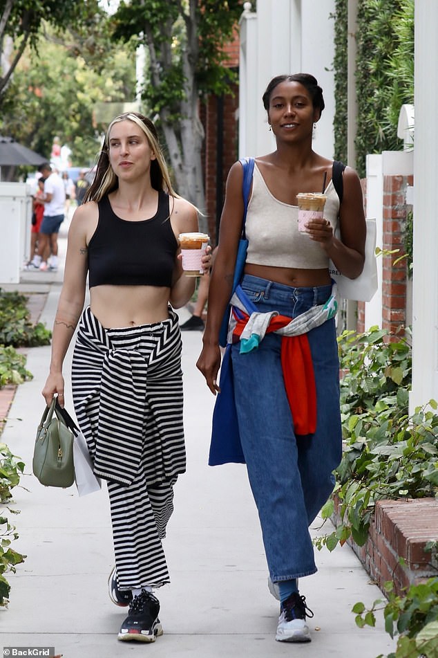 If you've got it! The Love Without Possession singer, 31, bared her trim tummy in a black crop top and funky striped pants, and sported a matching striped jacket tied around her waist