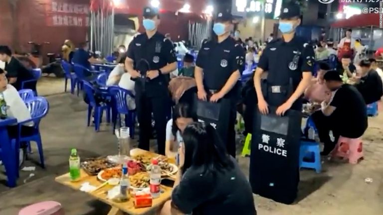 Images show Chinese SWAT officers hovering over unaccompanied women following assaults