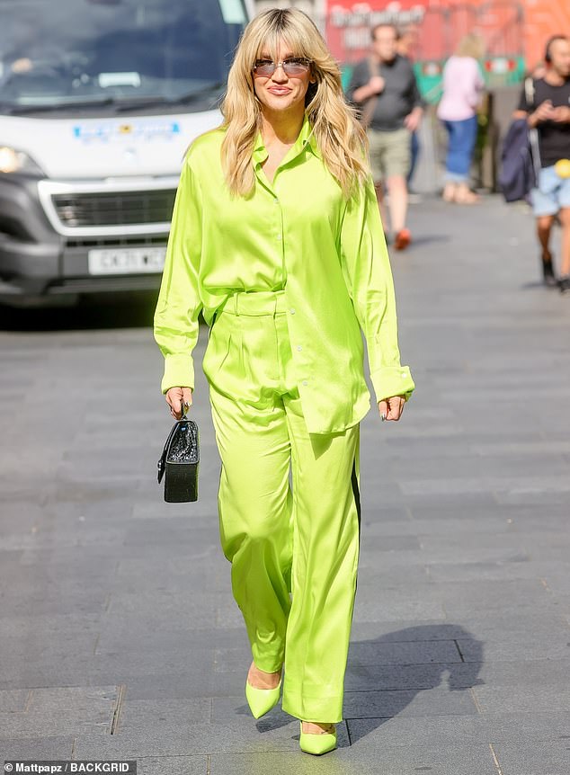 Ashley Roberts shines bright in a stunning neon green silk co-ord and stilettos