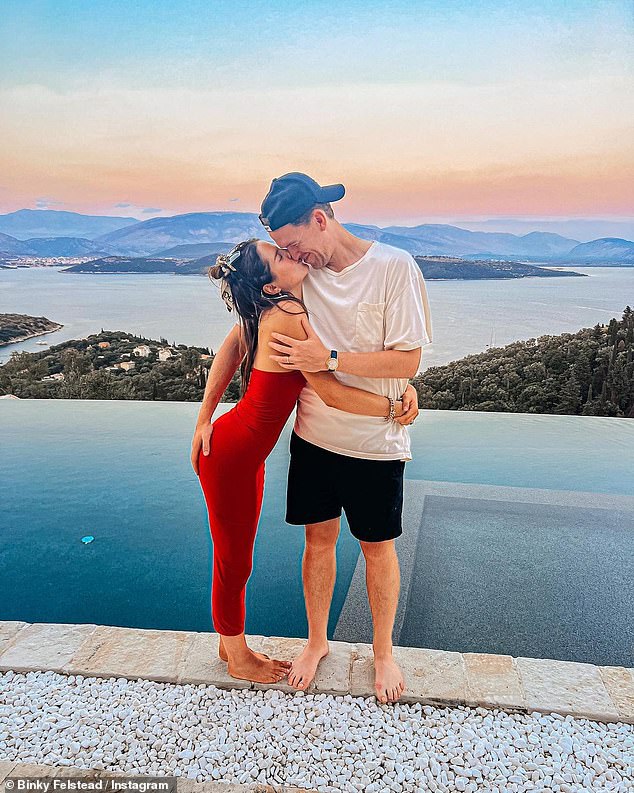 Binky Felstead slips into a tight red maxi dress as she poses with husband Max in Corfu