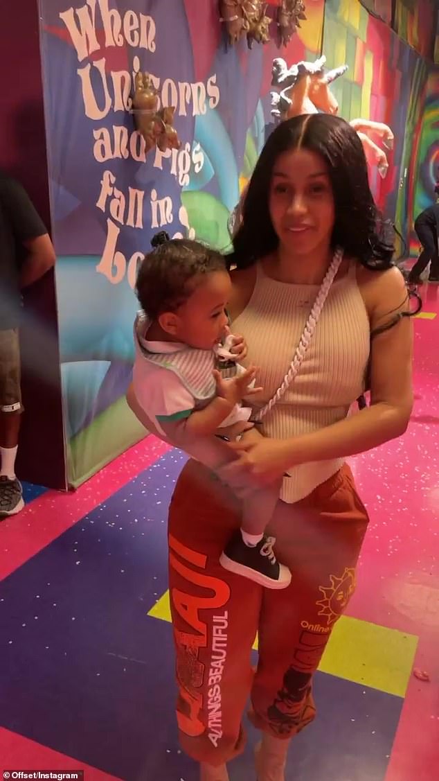 Cardi B is ever the doting mother as she spends time with her family at the Candytopia exhibit