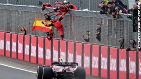 Sainz crosses the finish line first to win the British Grand Prix.