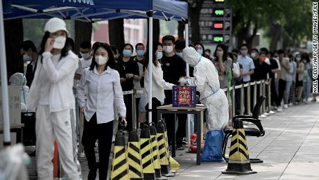 People queue at a Covid testing site in Beijing on June 13.