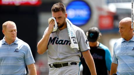 Castano walks off of the field after being hit by a line drive in the head.