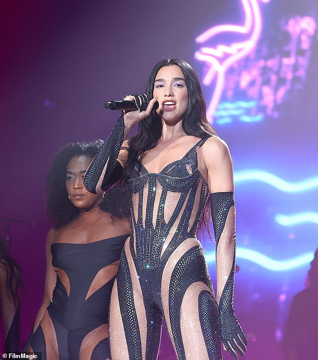 Dua Lipa slips into a bedazzled catsuit as she rocks Lollapalooza stage