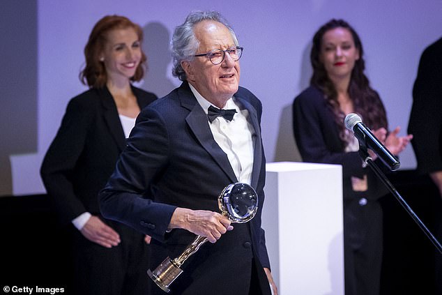 Geoffrey Rush accepts crystal globe at the Karlovy Vary International Film Festival 