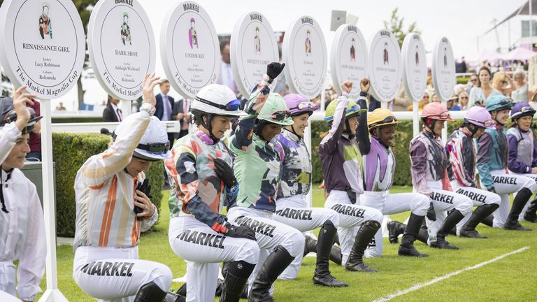 The Magnolia Cup riders take a knee before Goodwood&#39;s charity race