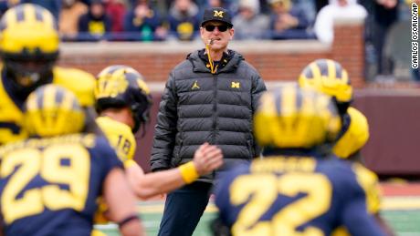 Harbaugh watches on during an intra-squad spring game.