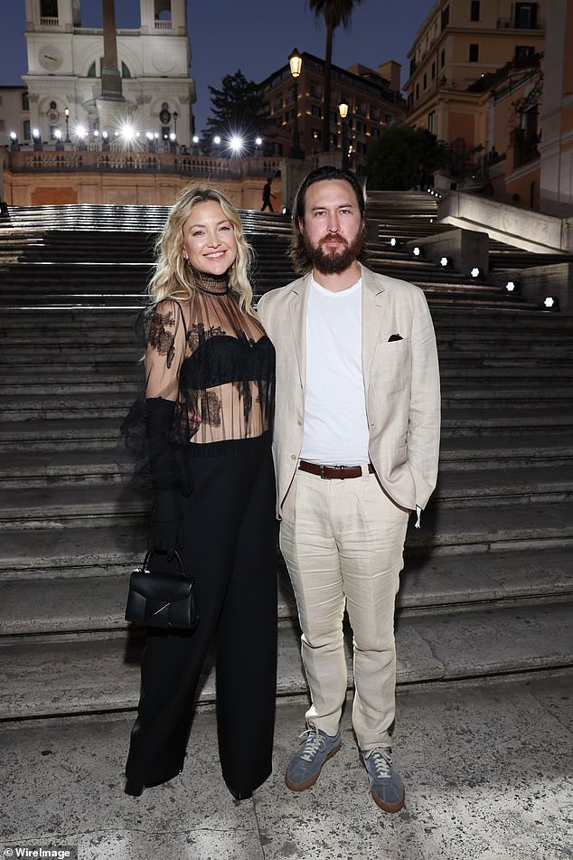 Kate Hudson flaunts her toned abs in a racy sheer blouse at the Valentino Haute Couture show