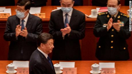 Chinese President Xi Jinping (bottom) is applauded by members of the government as he arrives for the closing session of the Chinese People&#39;s Political Consultative Conference (CPPCC) at the Great Hall of the People on March 10, 2022 in Beijing, China. China&#39;s week-long annual political gathering, known as the Two Sessions, convenes the nation&#39;s leaders and lawmakers to set the government&#39;s agenda for domestic economic and social development for the next year. 