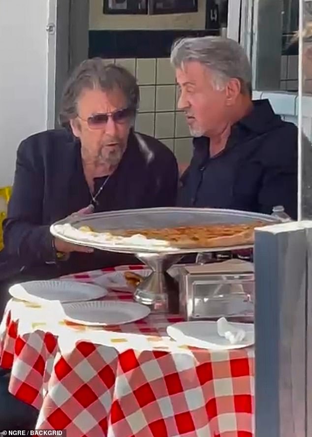 Rocky meets Scarface! Sylvester Stallone and Al Pacino enjoy a pizza together in Beverly Hills