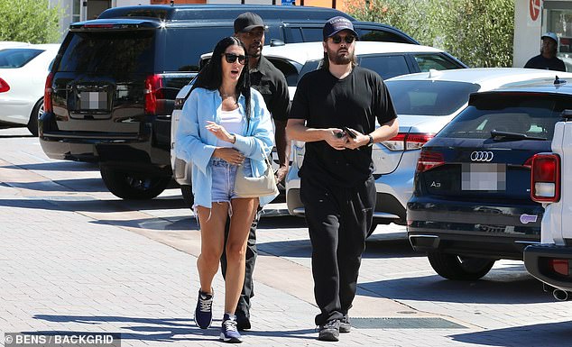 Scott Disick is casual in all black as he steps out in Malibu with his assistant and security detail