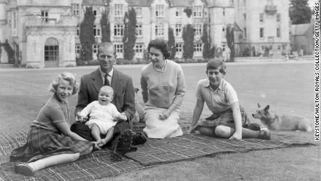 Queen Elizabeth II and Prince Philip picnic with three of their children outside Balmoral in 1960.