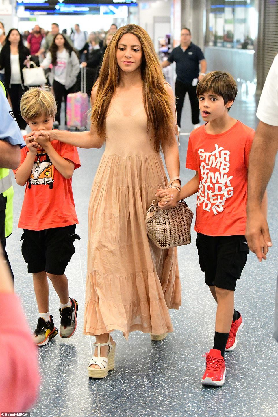 Sweet! Sasha was seen giving his mom a gentle kiss on her hand