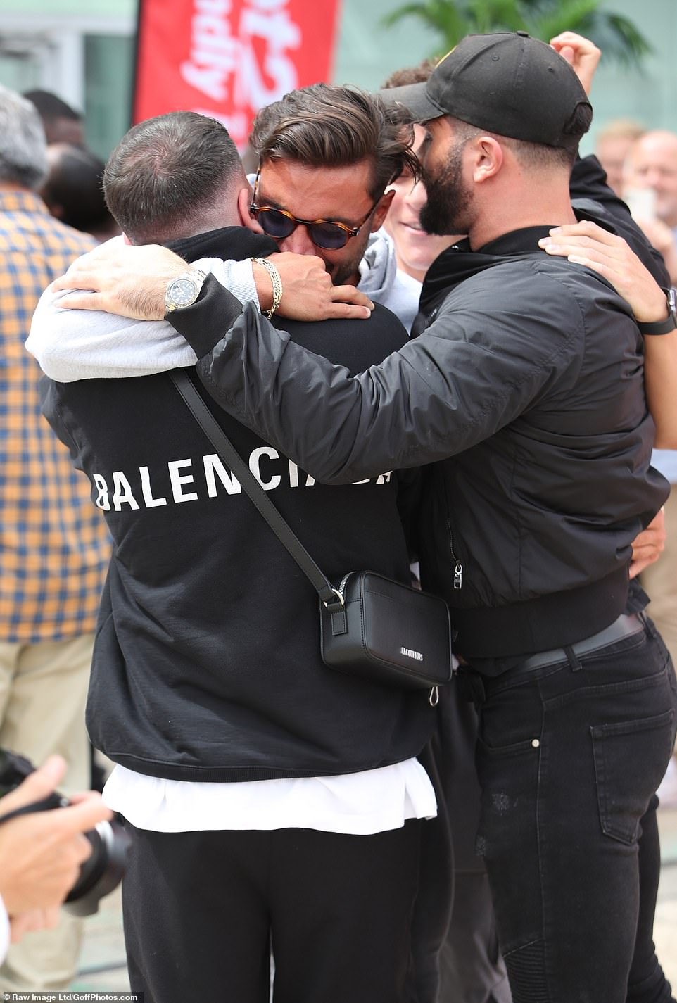 He's back! Davide was seen embracing his friends and family outside the airport, after the stars returning to the UK following Monday's finale