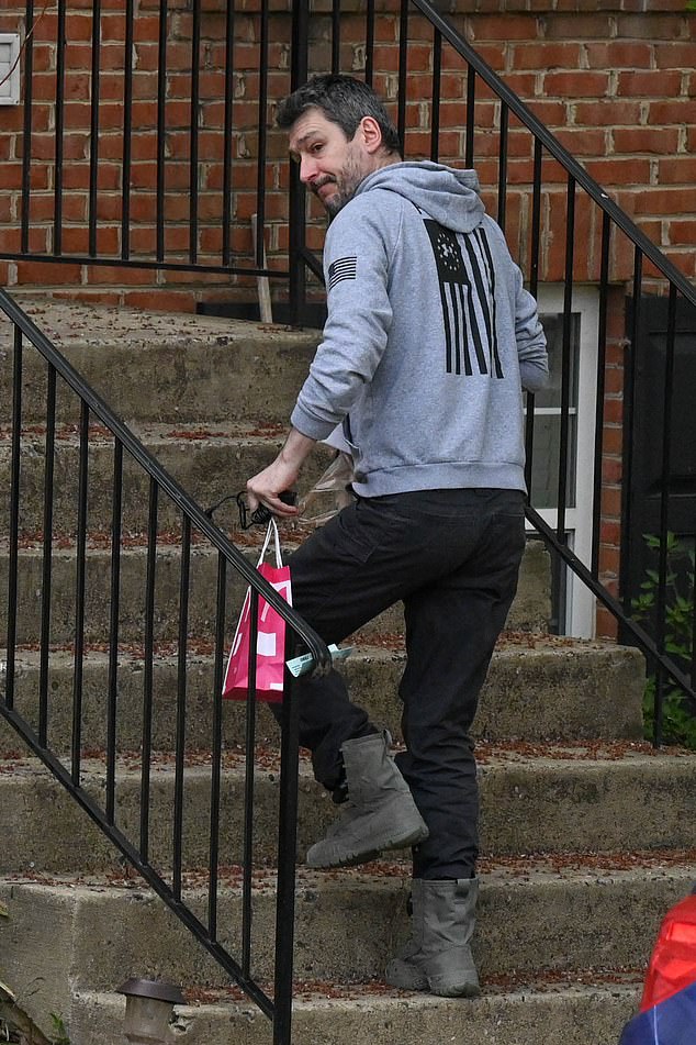 Arian Taherzadeh is pictured entering his father's home in Sterling on April 13, 2022 after the government didn't file an appeal to have him kept behind bars in a Washington D.C. jail