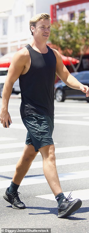 Sporty: Will teamed his black vest with a matching pair of shorts, showing off his muscular frame