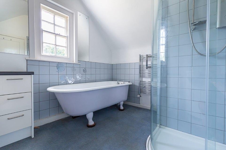 All of the bomb proof shelters, ammunition stores, gun positions and defensive structure remain intact in the 13,724 square feet of grounds. Pictured: A spacious bathroom in the manor