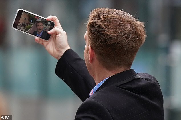 Belfield taking a selfie outside Nottingham Crown Court before an earlier court appearance