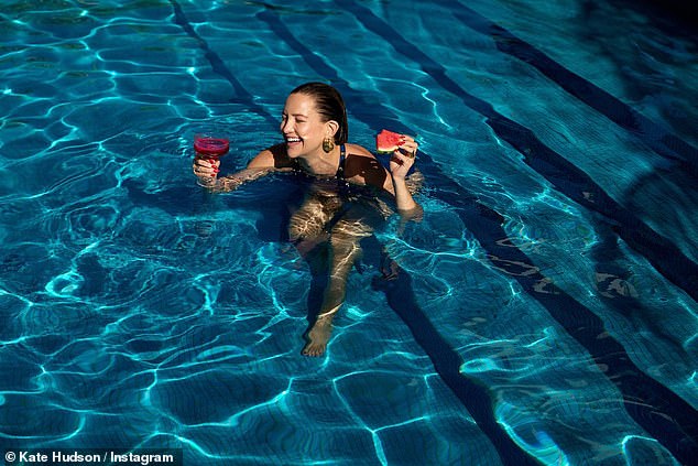 Taking a dip: Hudson was seen enjoying the watermelon cocktail in the pool