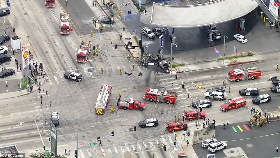 Skid marks are seen on the ground at the intersection as investigators on Thursday evening tried to work out what had happened