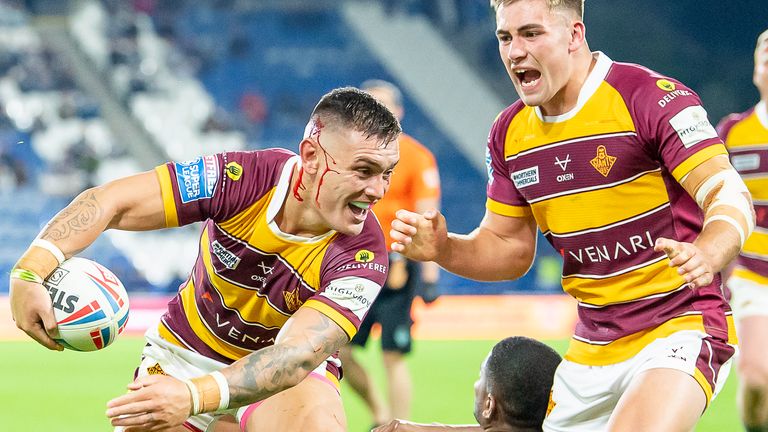 Levi celebrates his game-clinching try for Huddersfield