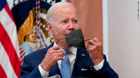 President Joe Biden removes his face mask as he arrives to speak about the economy during a meeting with CEOs in the South Court Auditorium on the White House complex in Washington, Thursday, July 28, 2022. (AP Photo/Susan Walsh)