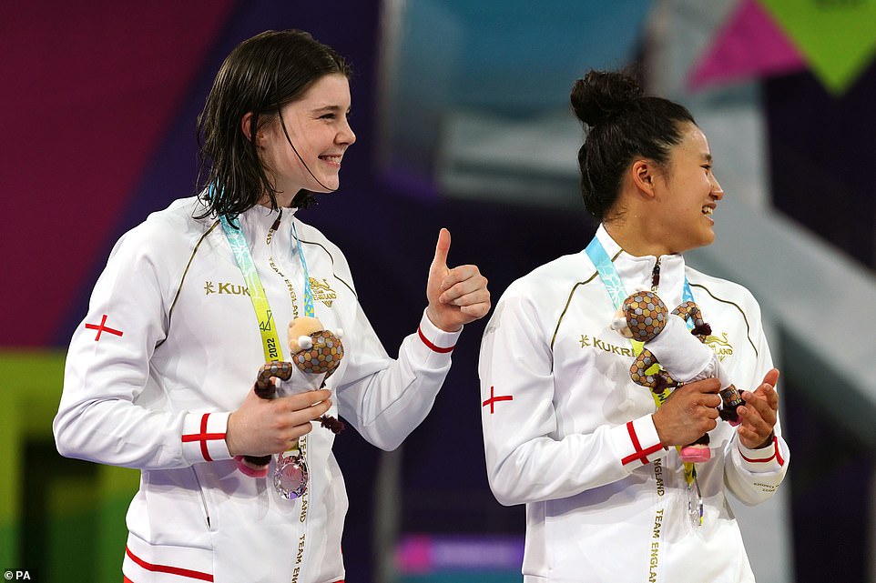 Awarded: Covering up with sporting outfits rather than their swimming costumes, the pair accepted their awards