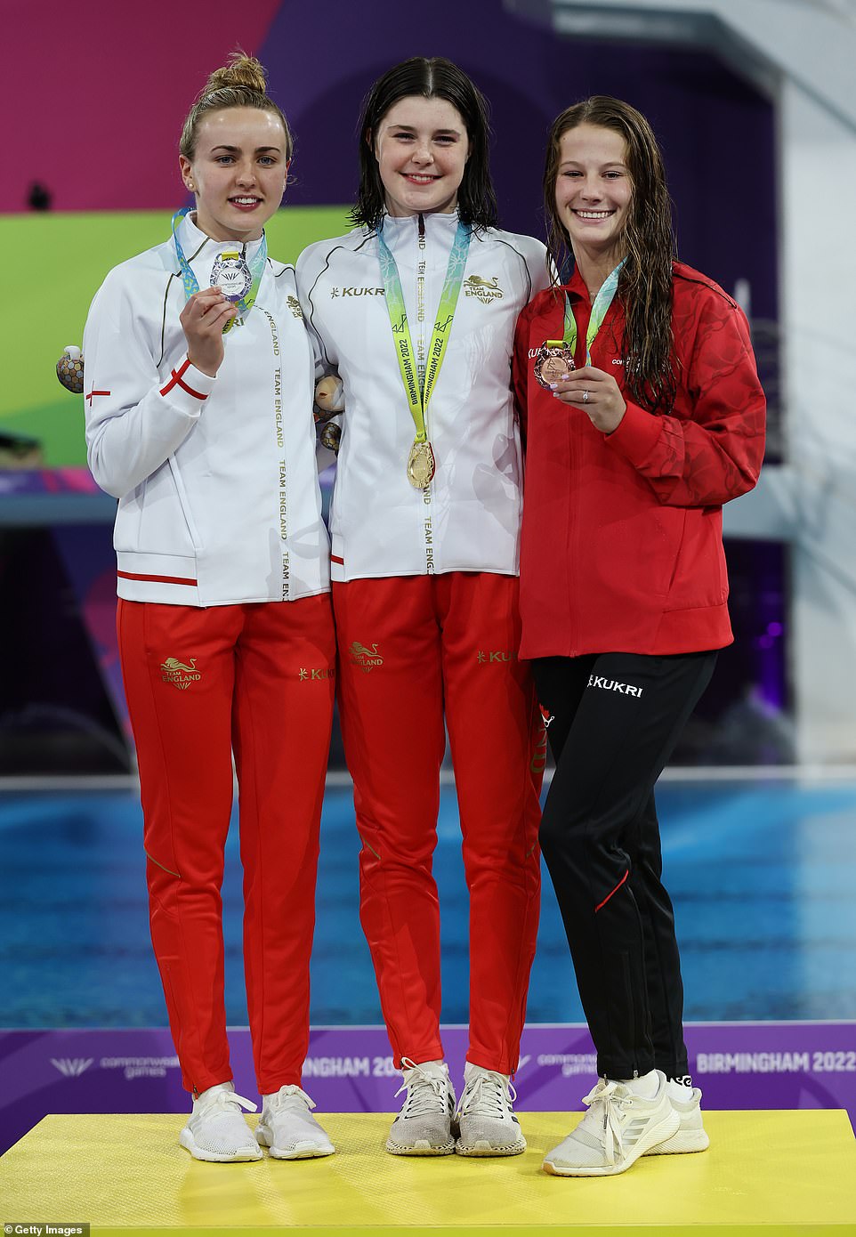 Well done: Andrea was joined by silver medallist and teammate Lois and Canadian bronze medallist Caeli Sierra McKay as they posed with their medals