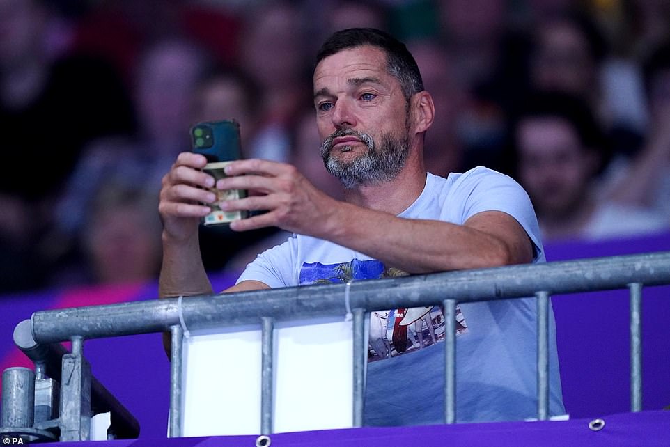 Filming: Fred was seen documenting the landmark moment as Andrea took part in the 10m Platform Final at her first Commonwealth Games