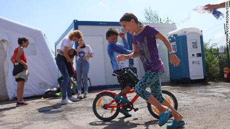 Children play in a refugee camp in Prague. Second from left is Nikol Hladikova, the social worker responsible for the camp&#39;s operations.