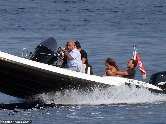 Holiday: Chloe cosied up next to boyfriend Manuele, who was dressed casually in a black T-shirt and a pair of shorts