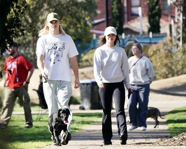 She teamed her look with a matching white cap and sneakers