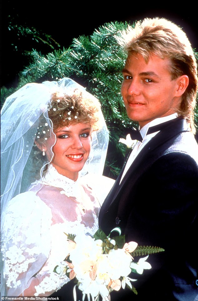 Legendary: He appeared alongside Kylie Minogue, who played his character's wife Charlene Robinson, as the pair revisited Ramsay Street as the long-running serial drew to an end (pictured in 1988)