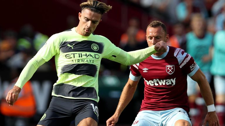 Manchester City&#39;s Jack Grealish (left) and West Ham United&#39;s Vladimir Coufal battle for the ball 