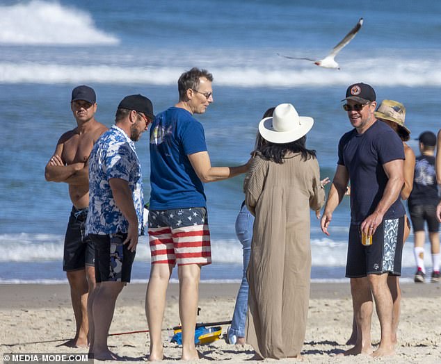 aThe Bourne Identity star wore a cap and covered his eyes beneath a pair of retro sunglasses