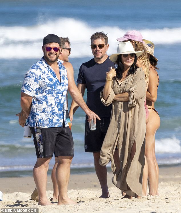 Luke meanwhile looked relaxed in a white-and-blue T-shirt, red sunglasses and shorts