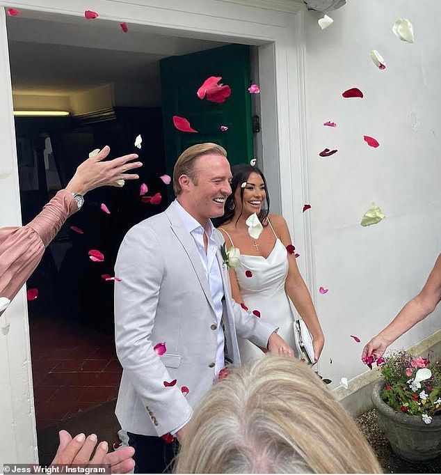 Just married: In one photo, she and William left the venue after saying 'I do' and were showered with petals by their nearest and dearest