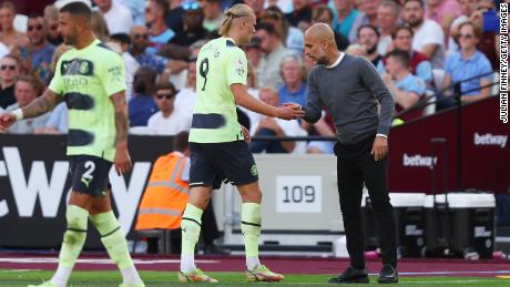 Guardiola and Haaland shake hands as the Norwegian is substituted against West Ham.