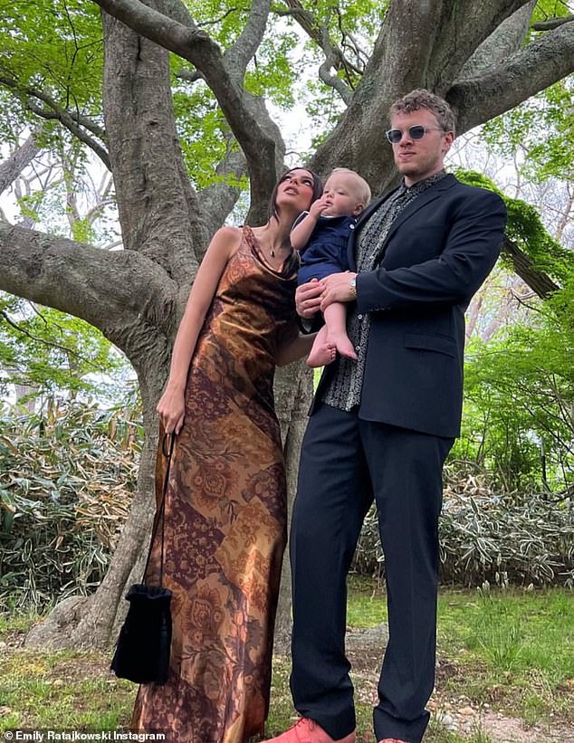 Family photo: Before their split, Emily is pictured with Sebastian and their one-year-old baby boy for an adorable family snap