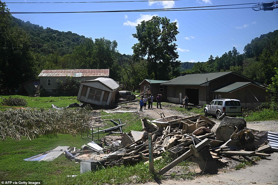 The presidential motorcade ride went past heavily damaged homes in Lost Creek, at least 37 people were killed in the storm's damage